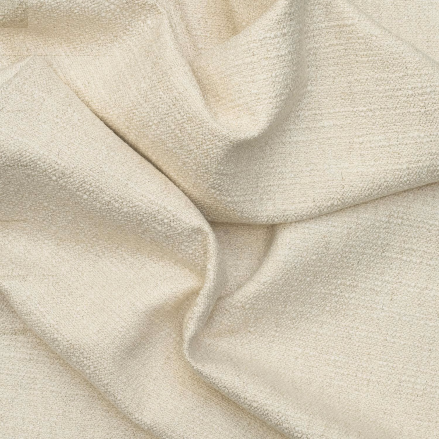 Pale chalk-cream plain textured fabric with fine grain and softly folded drape