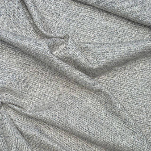 Cool grey woven fabric with fine heathered texture and softly folded surface