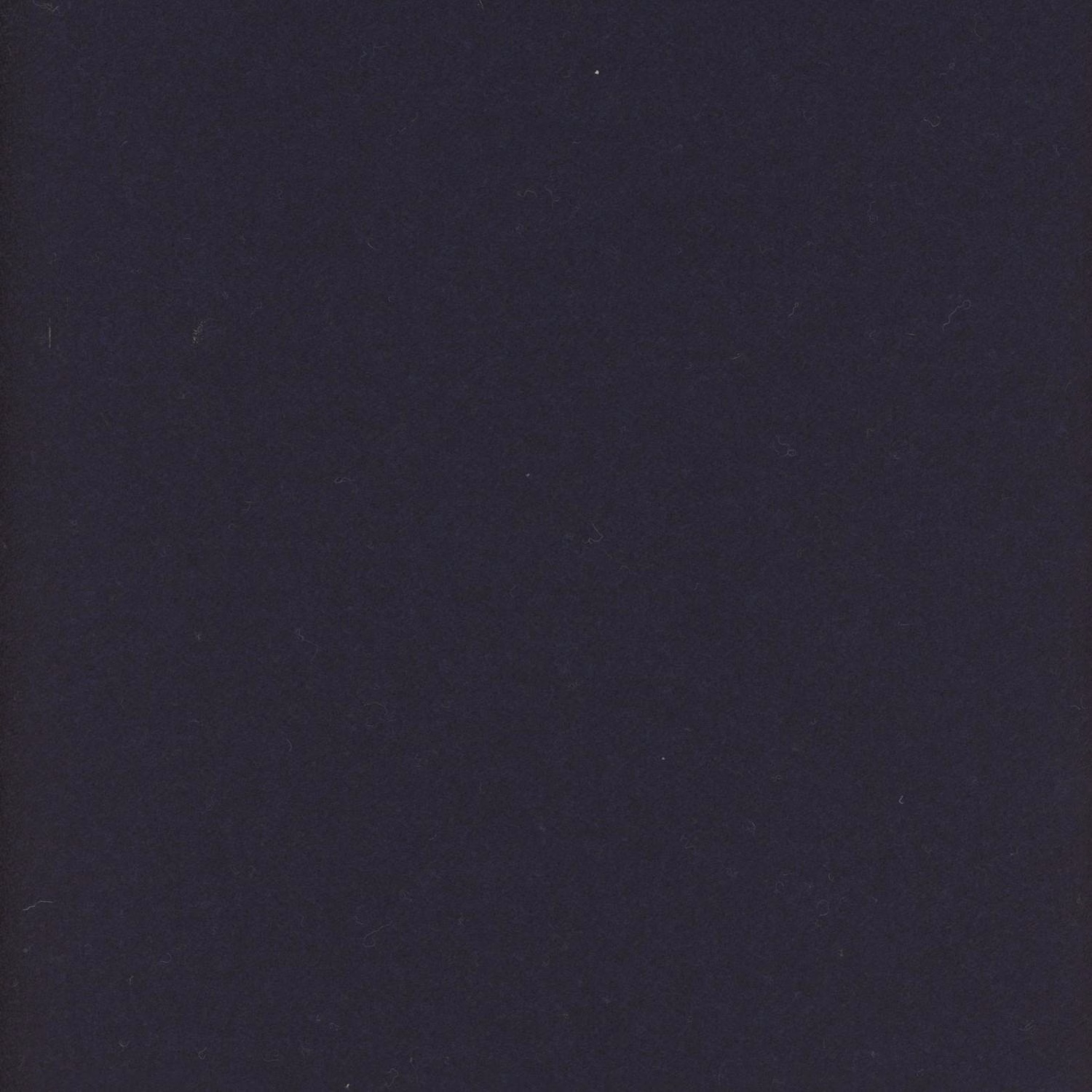 Close-up of deep ink navy fabric with a subtle, softly mottled textile surface