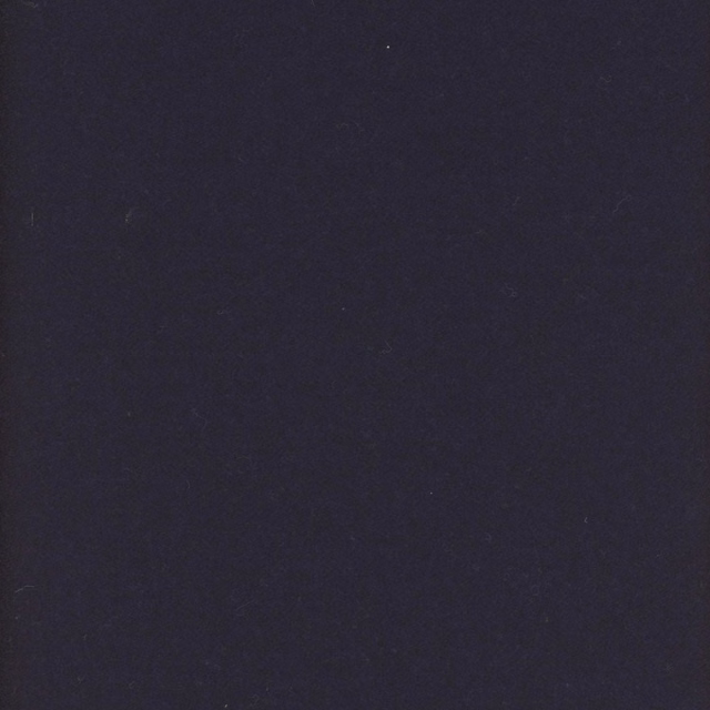 Close-up of deep ink navy fabric with a subtle, softly mottled textile surface