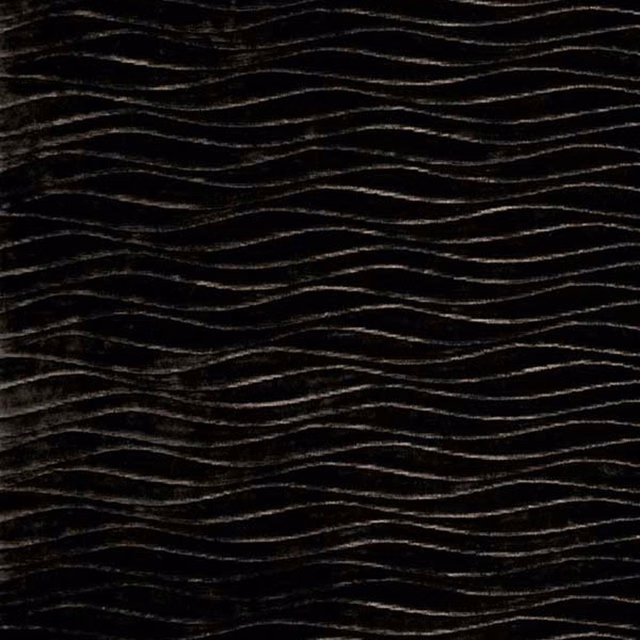 Deep chocolate-brown fabric with fine undulating lines and a dark, tactile surface