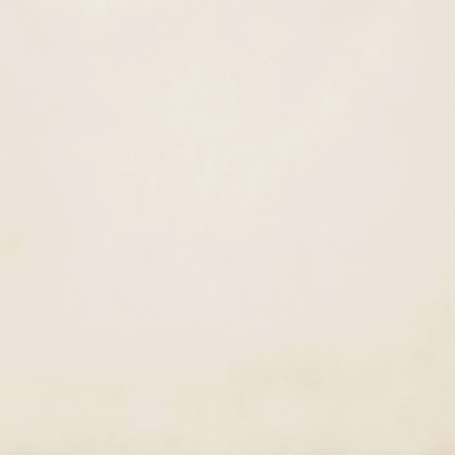 Pale ivory cream plain fabric swatch with a smooth matte finish