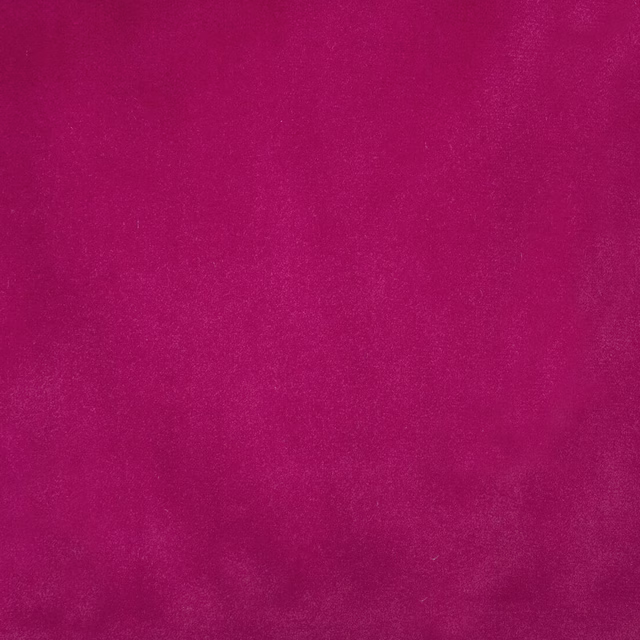Close-up of a vivid fuchsia plain fabric with a soft brushed texture