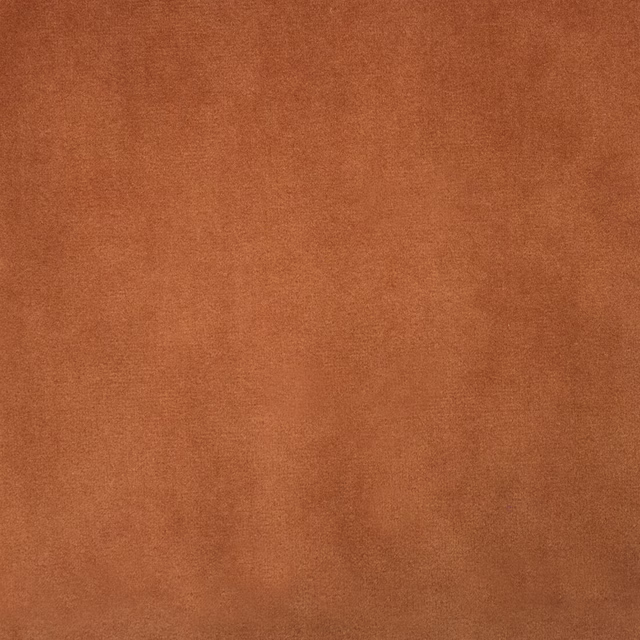 Rust orange plain fabric swatch with a soft matte, velvety surface