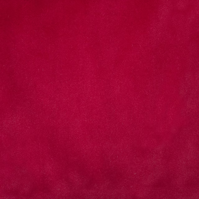 Close-up of a rich scarlet red plain fabric with a smooth brushed texture