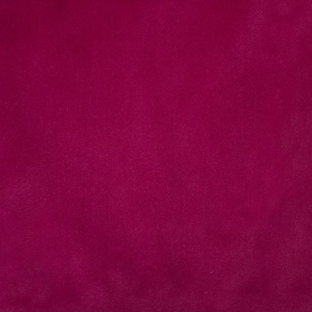 Deep wine-red plain fabric swatch with a softly mottled, velvety surface