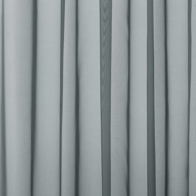 Soft aqua plain curtain fabric with a smooth fine weave and gentle folded drape