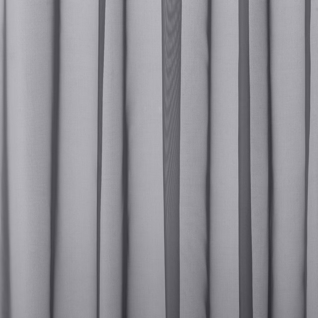 Cool pale grey drapery fabric hanging in soft vertical folds