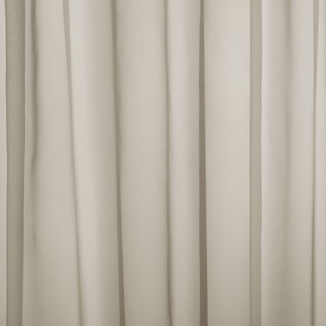 Soft cream plain curtain fabric with a smooth, closely woven surface