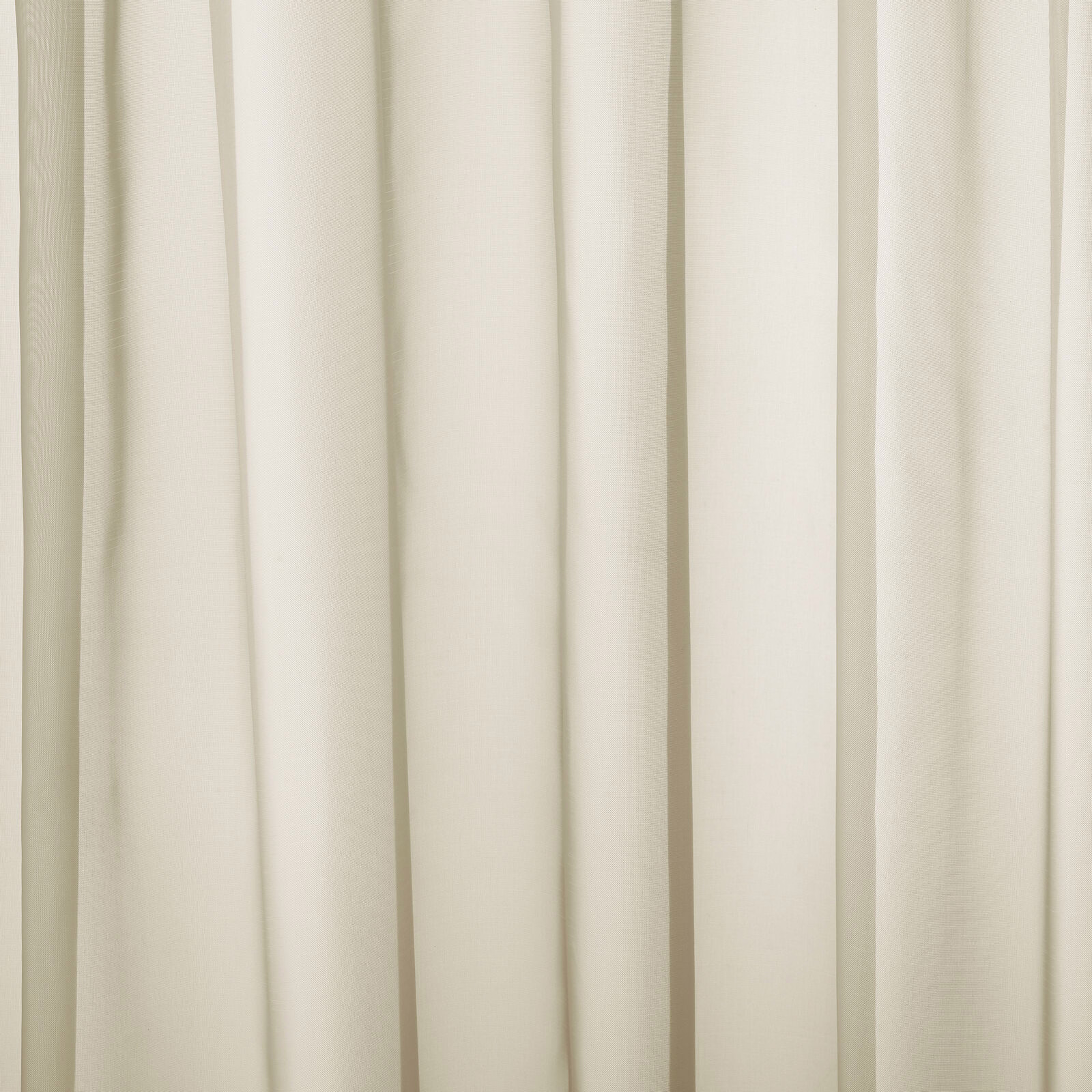 Pale oyster cream plain fabric hanging in soft vertical folds