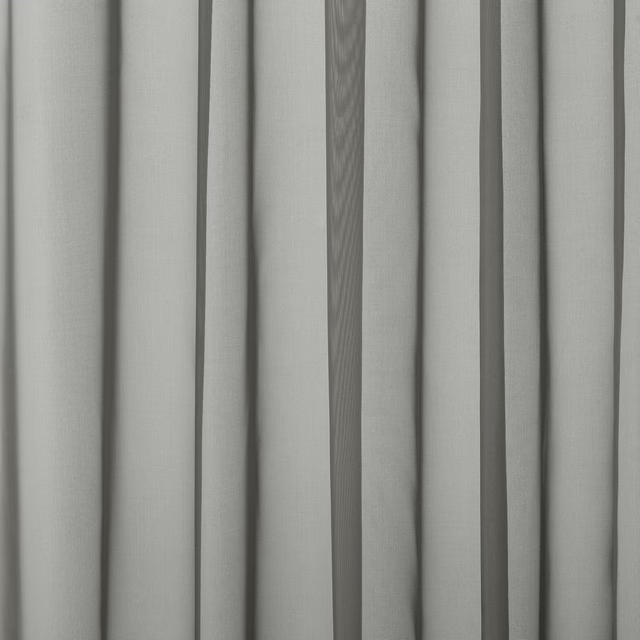 Soft pebble grey plain fabric hanging in narrow vertical folds