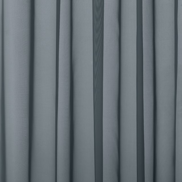 Soft slate-blue plain curtain fabric with gentle vertical folds and a smooth weave