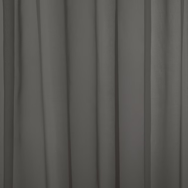 Gathered plain smoky grey curtain fabric with a soft matte finish