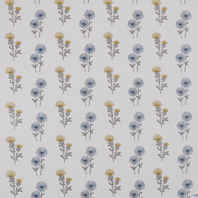 Ivory floral fabric with small blue and yellow botanical sprigs in a neat repeat