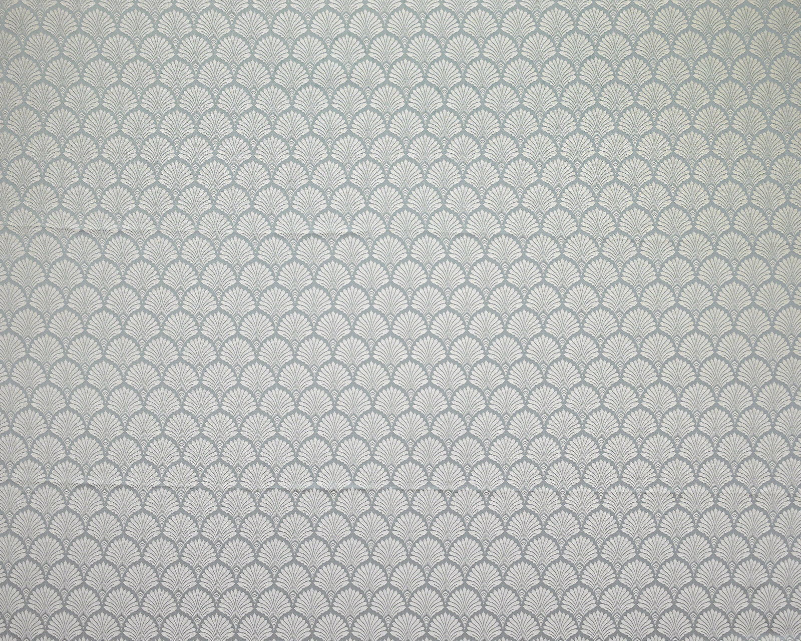 Soft mineral blue fabric with small ivory fan motif repeat