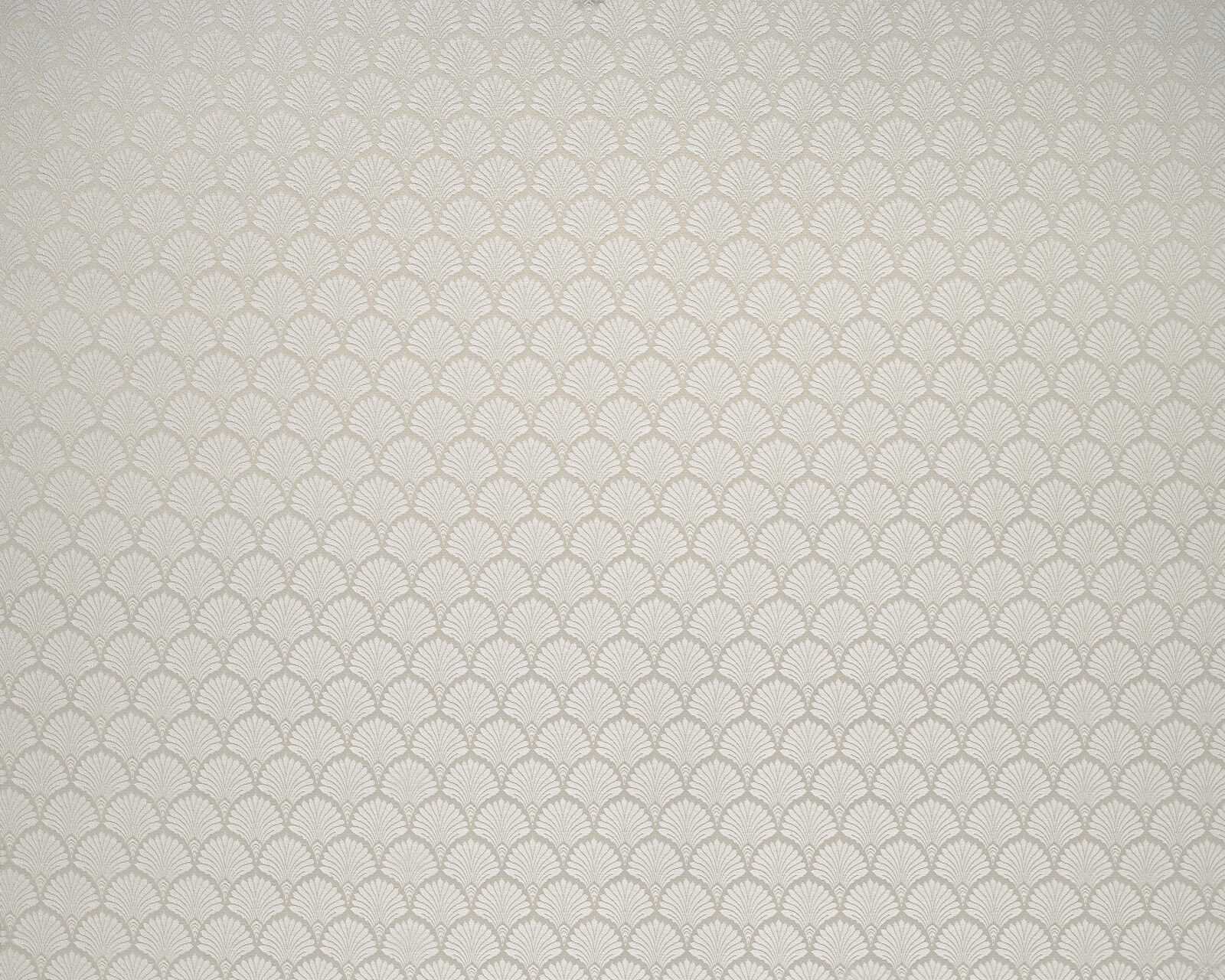 Oyster cream fabric with small repeating fan motif and subtle woven texture