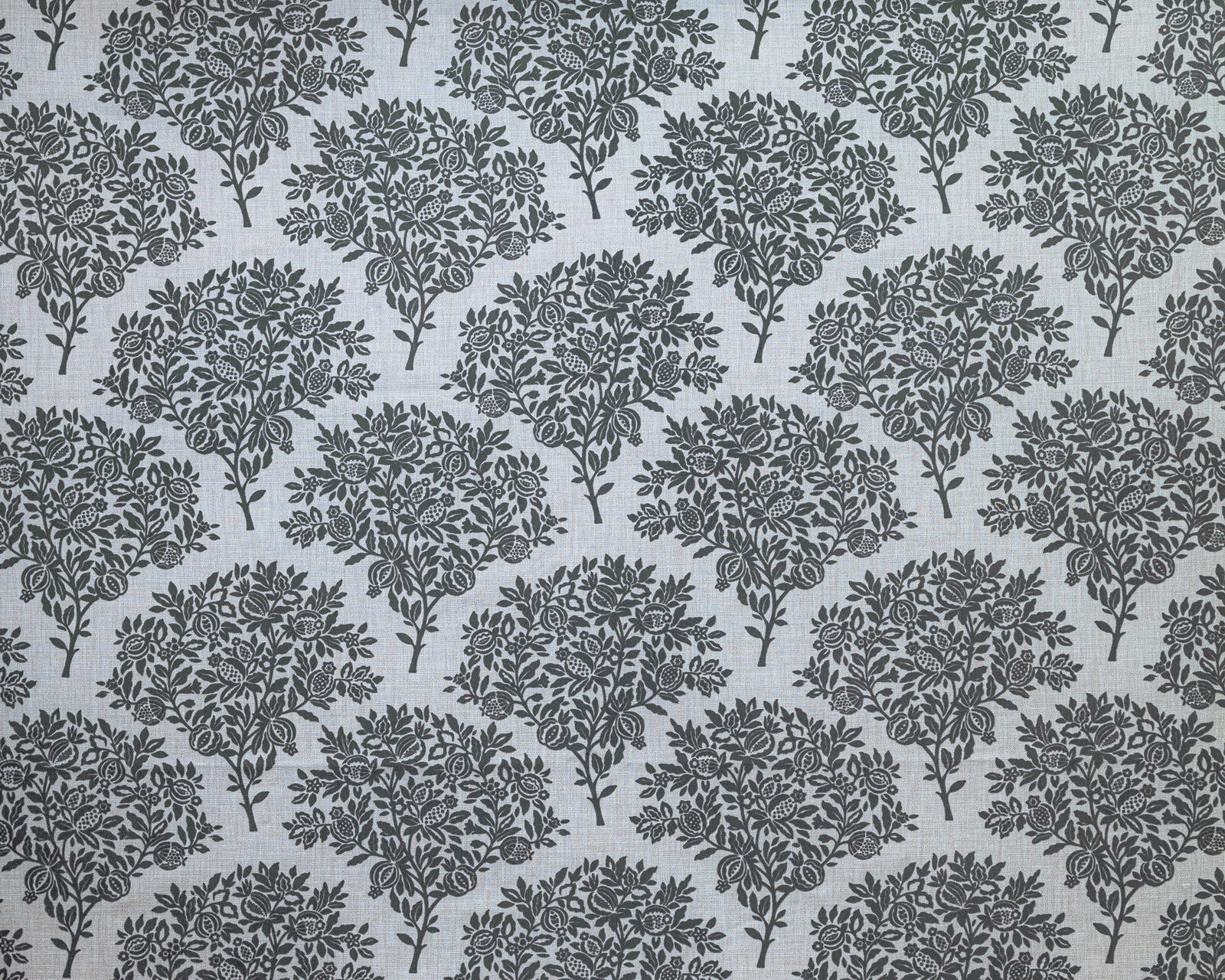 Repeated botanical tree motif in dark blue-grey on a pale Wedgwood blue fabric