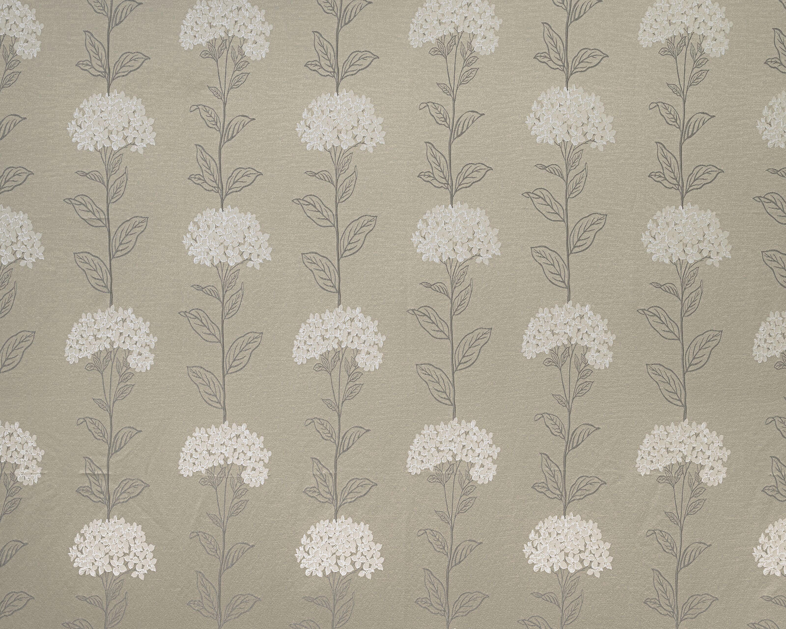 Beige caramel fabric with trailing ivory floral sprigs in a vertical repeat