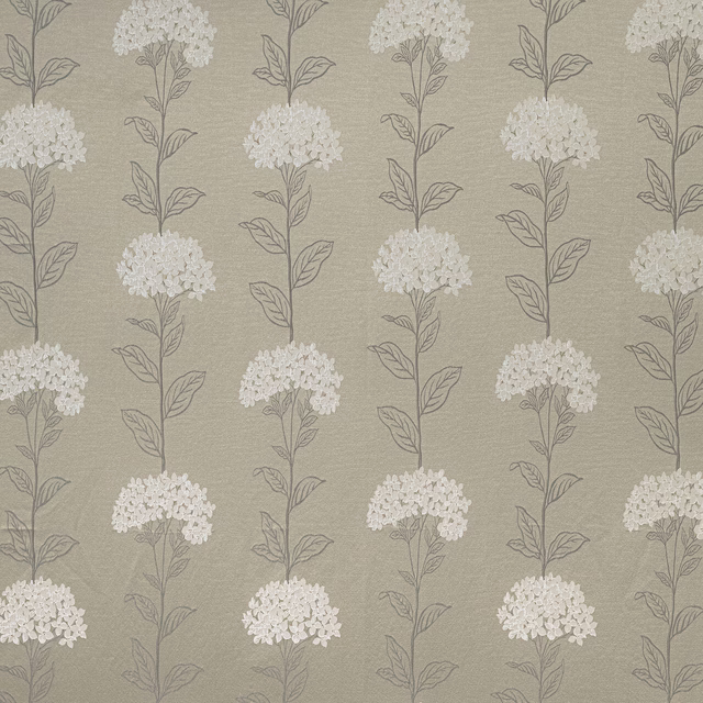 Beige caramel fabric with trailing ivory floral sprigs in a vertical repeat