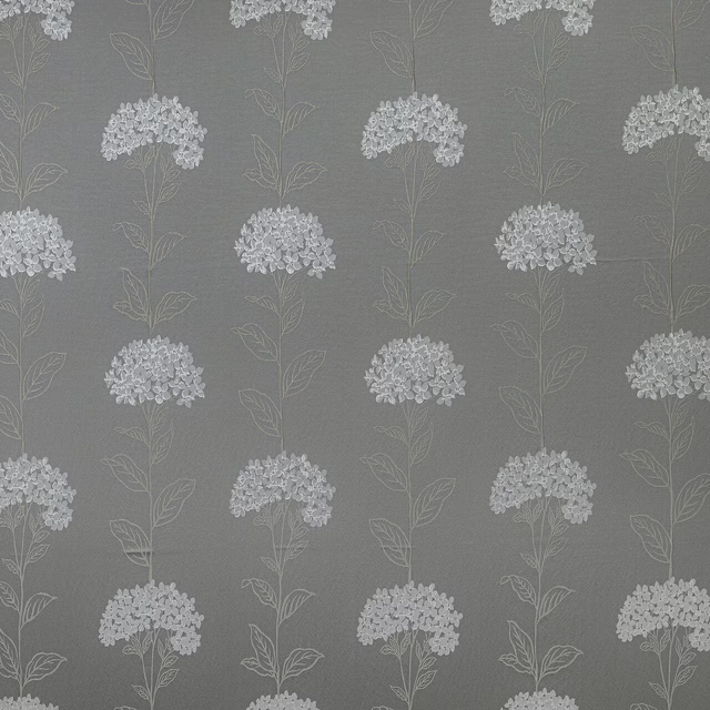 Soft grey botanical fabric with pale floral stems and clustered blooms