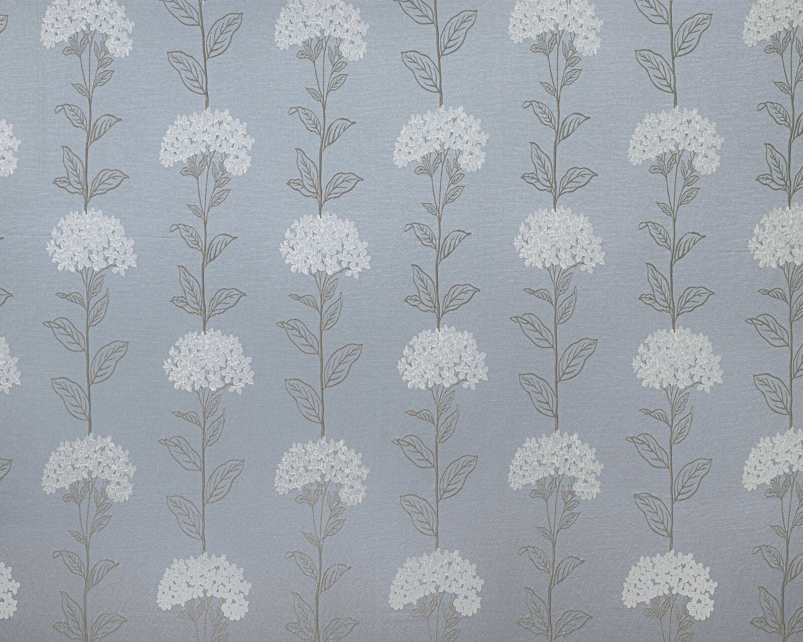 Soft wedgewood blue floral fabric with white blossom clusters and fine leaf outlines