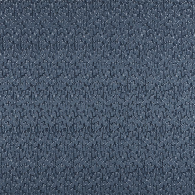 Close-up of slate blue textured fabric with small pebble-like weave
