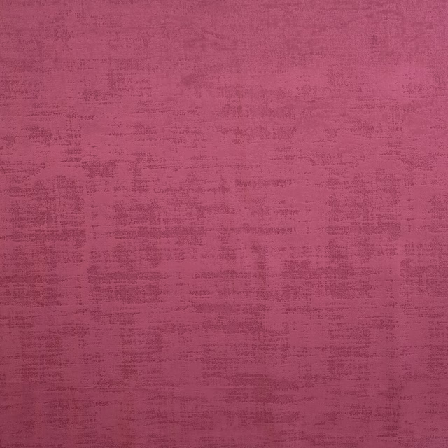 Berry pink textured plain fabric swatch with a brushed, weathered finish