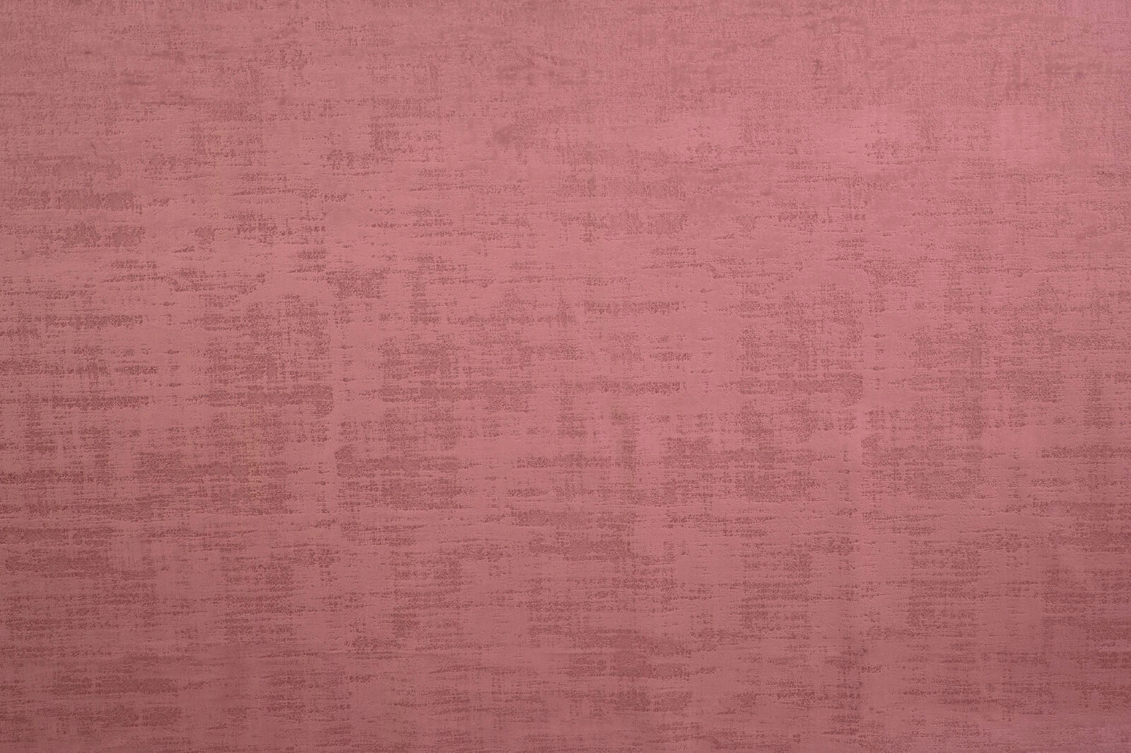 Dusty rose pink textured fabric swatch with subtle strié weave