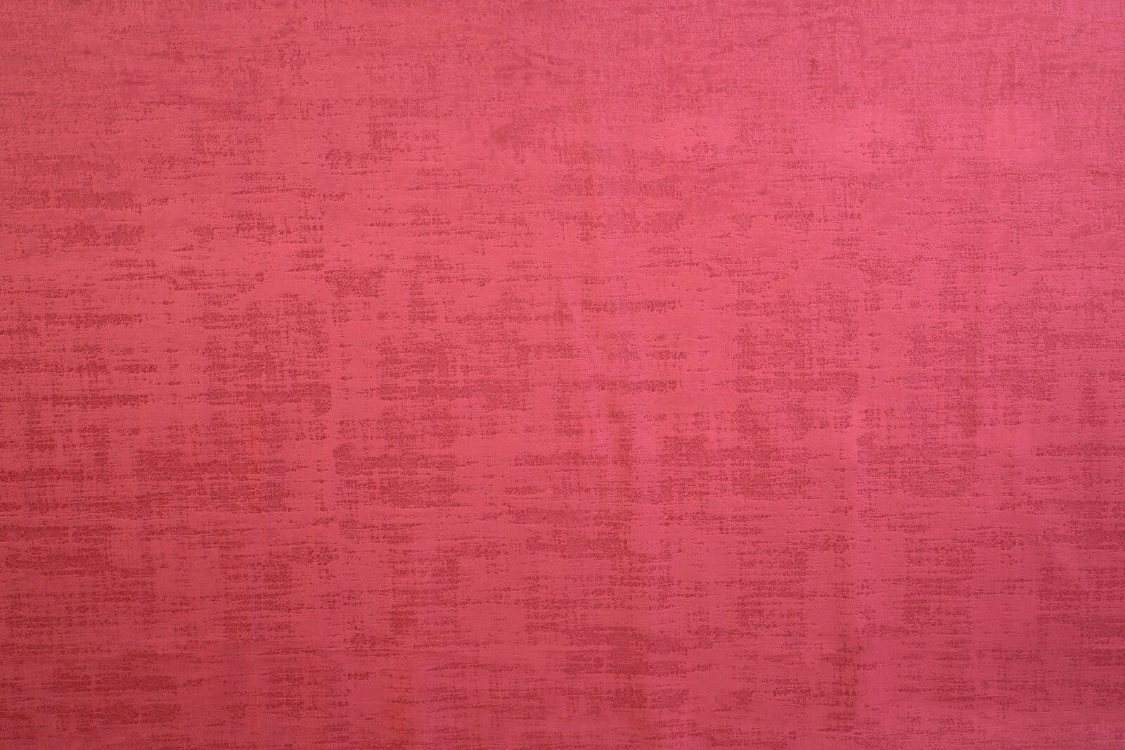 Rich raspberry pink textured plain fabric swatch with subtle tonal striations