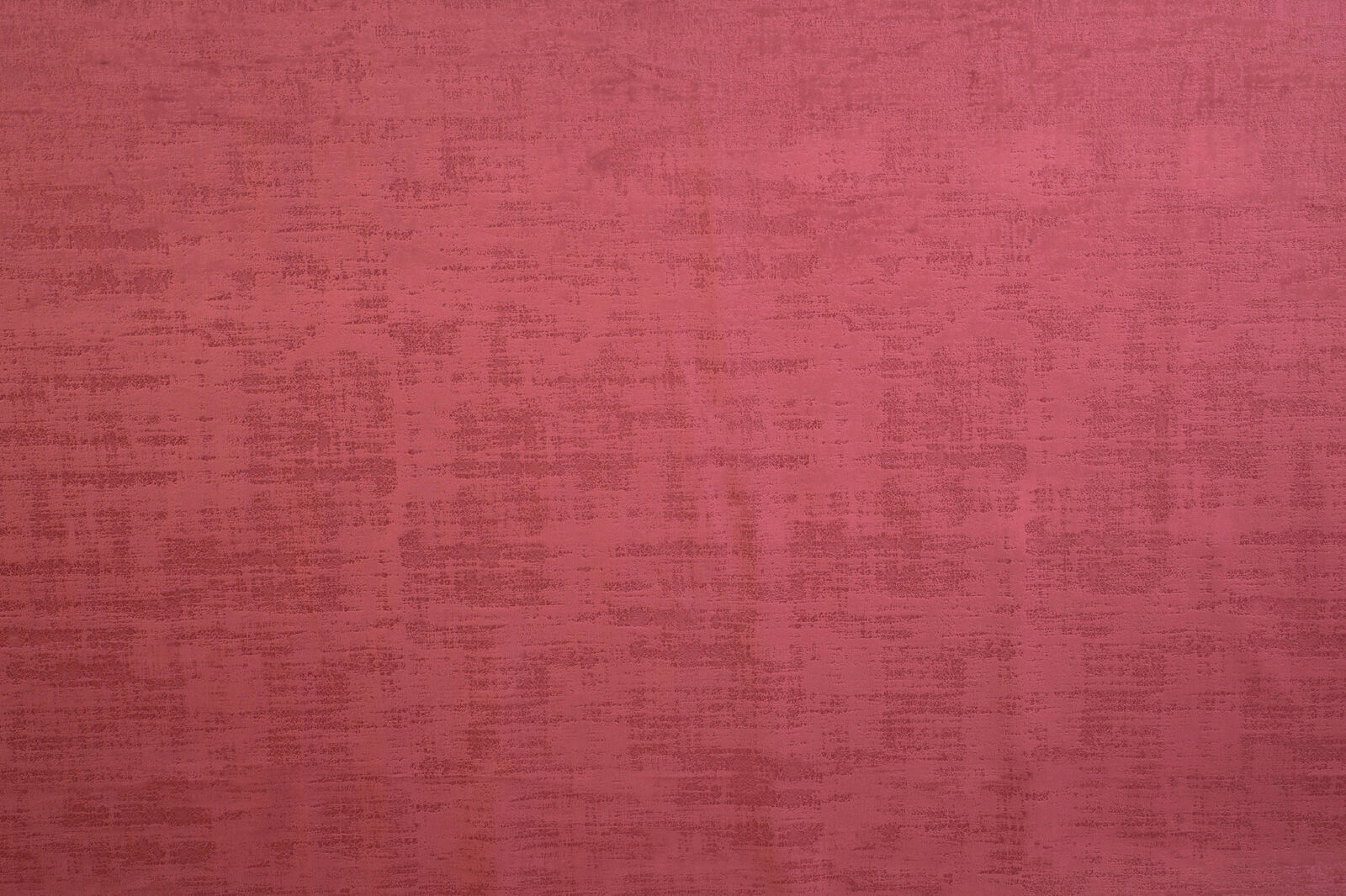 Deep claret red textured plain fabric with a subtle mottled weave