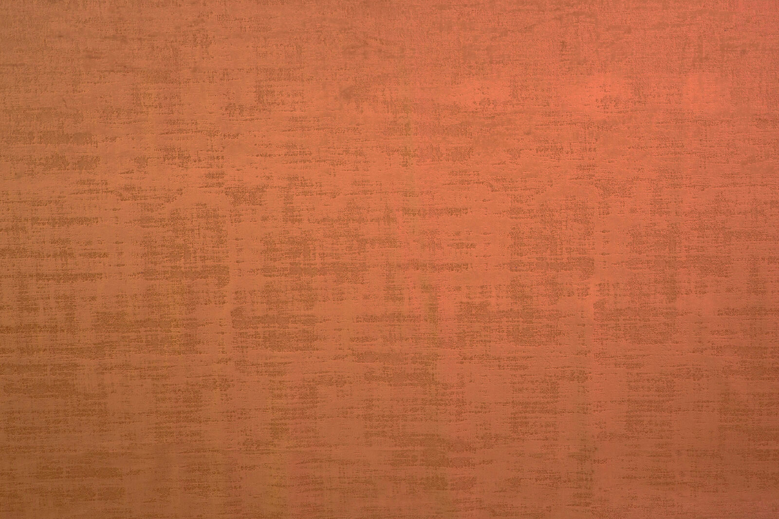 Warm saffron orange textured plain fabric with mottled weave
