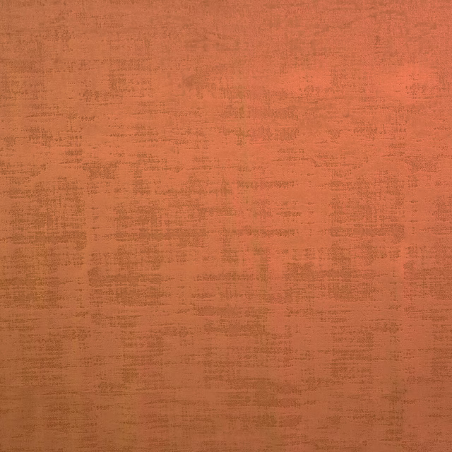 Warm saffron orange textured plain fabric with mottled weave