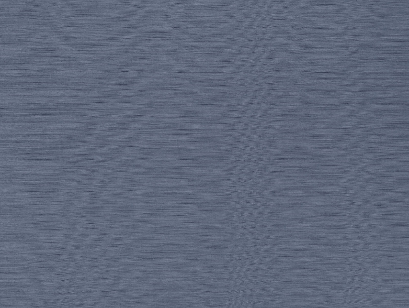 Close-up of muted denim blue plain fabric with fine horizontal weave texture