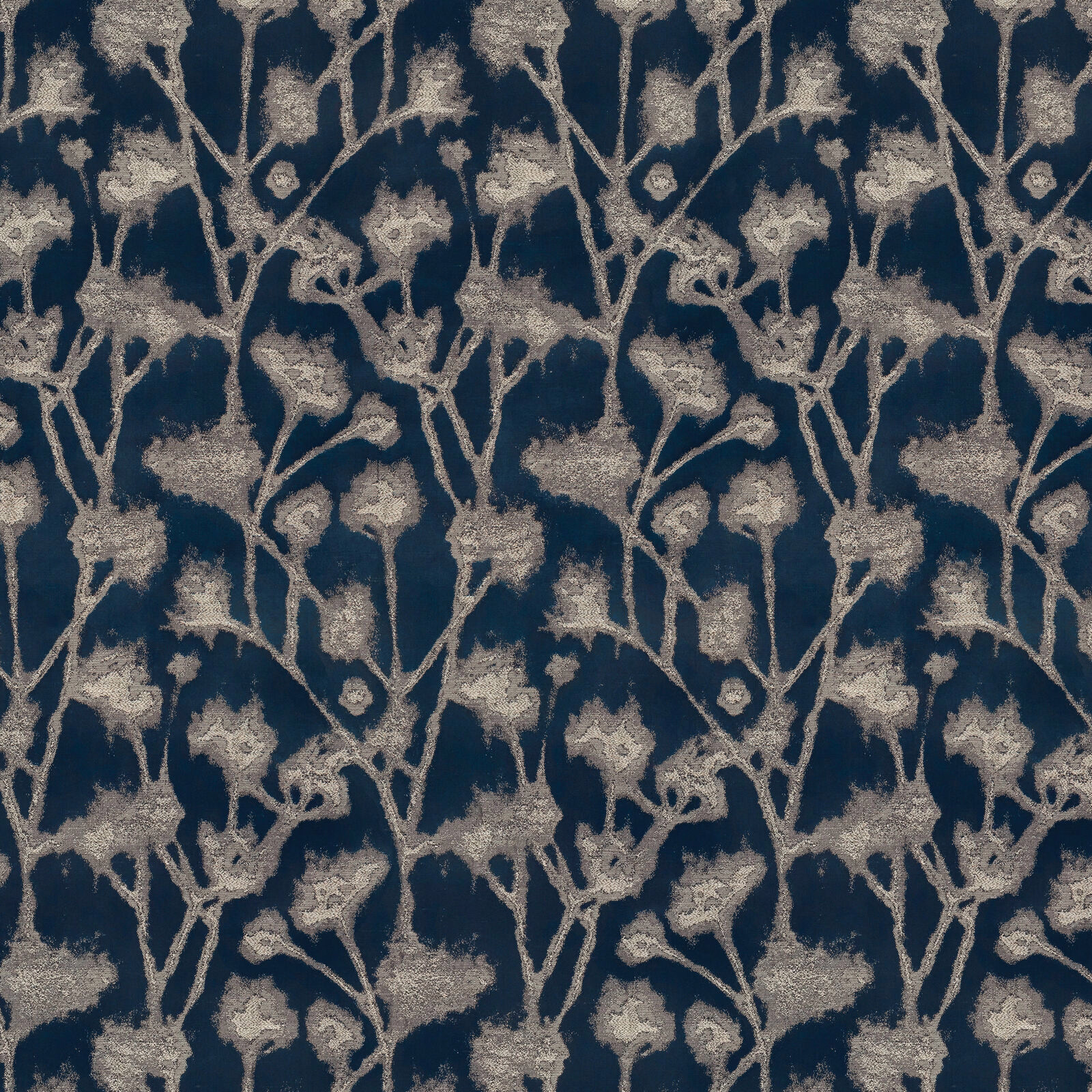 Inky blue botanical drapery fabric with pale beige leafy stems and textured motif