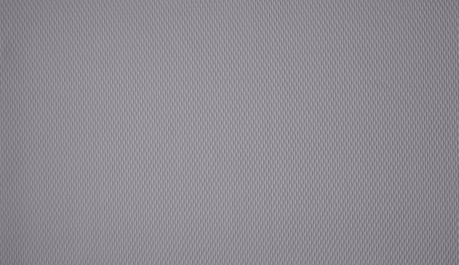 Close-up of cool graphite grey woven fabric with fine small-scale texture