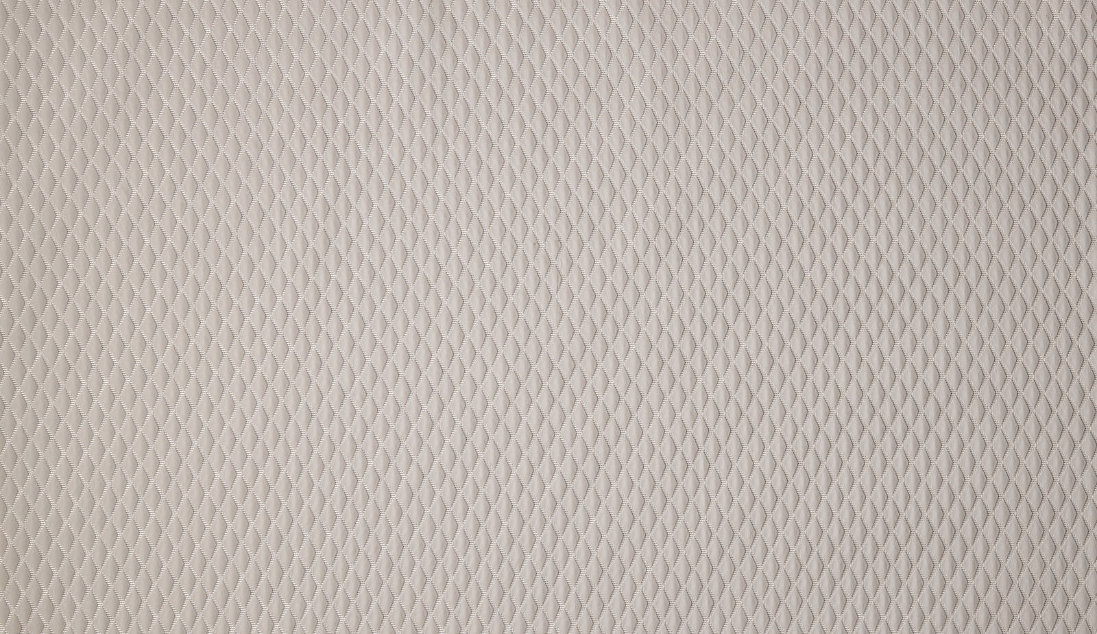 Close-up of pale taupe woven fabric with small diamond texture