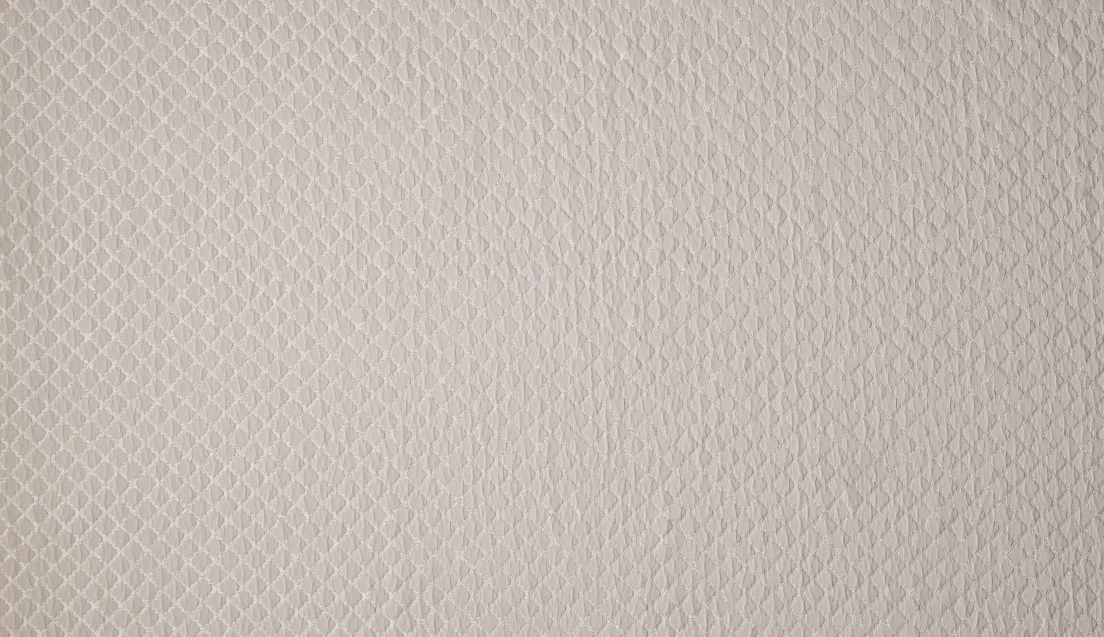 Close-up of soft taupe woven fabric with tiny geometric texture