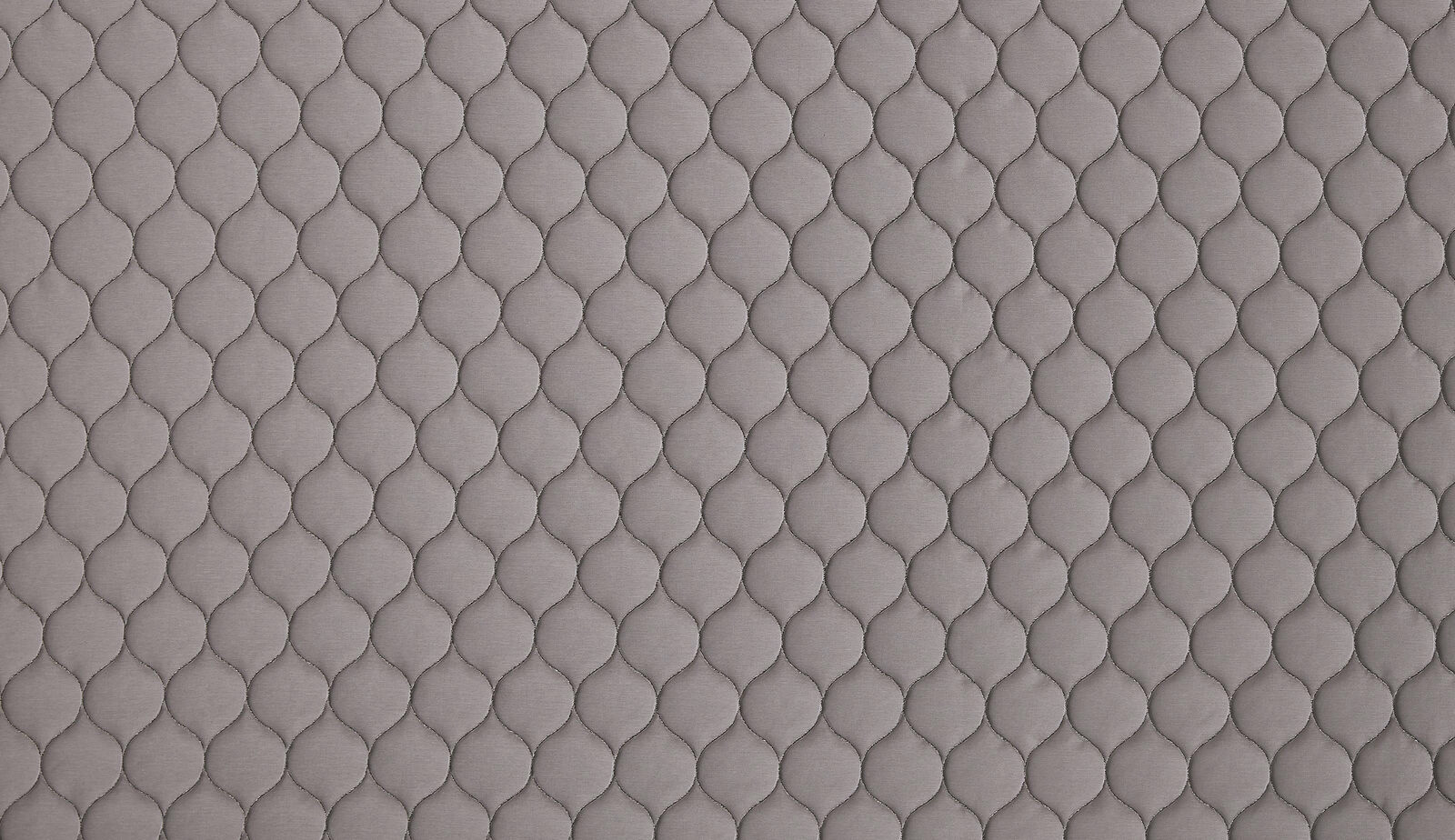 Soft graphite grey fabric with small embossed linked-scale texture