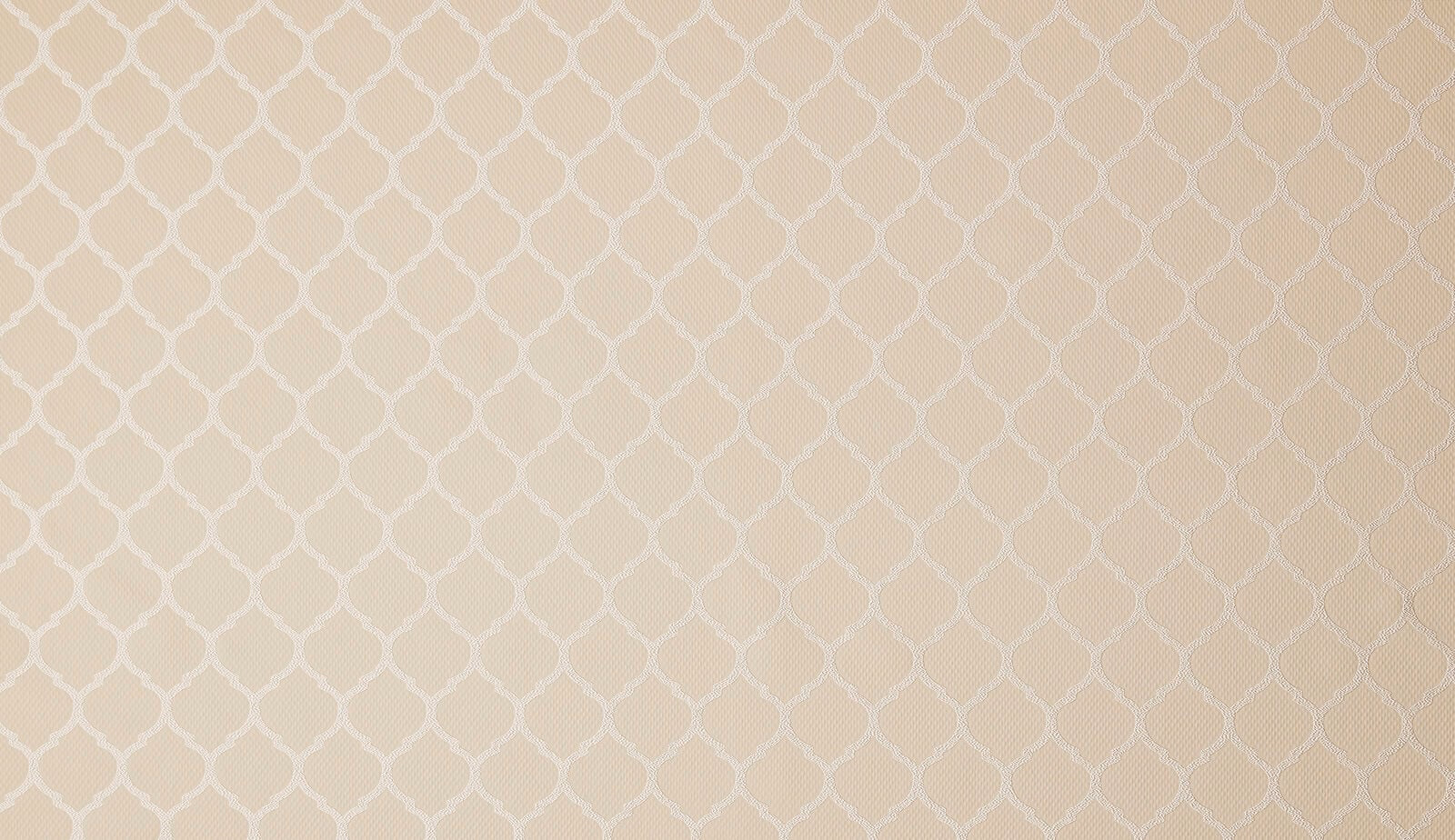 Pale champagne cream woven fabric with a small geometric lattice pattern