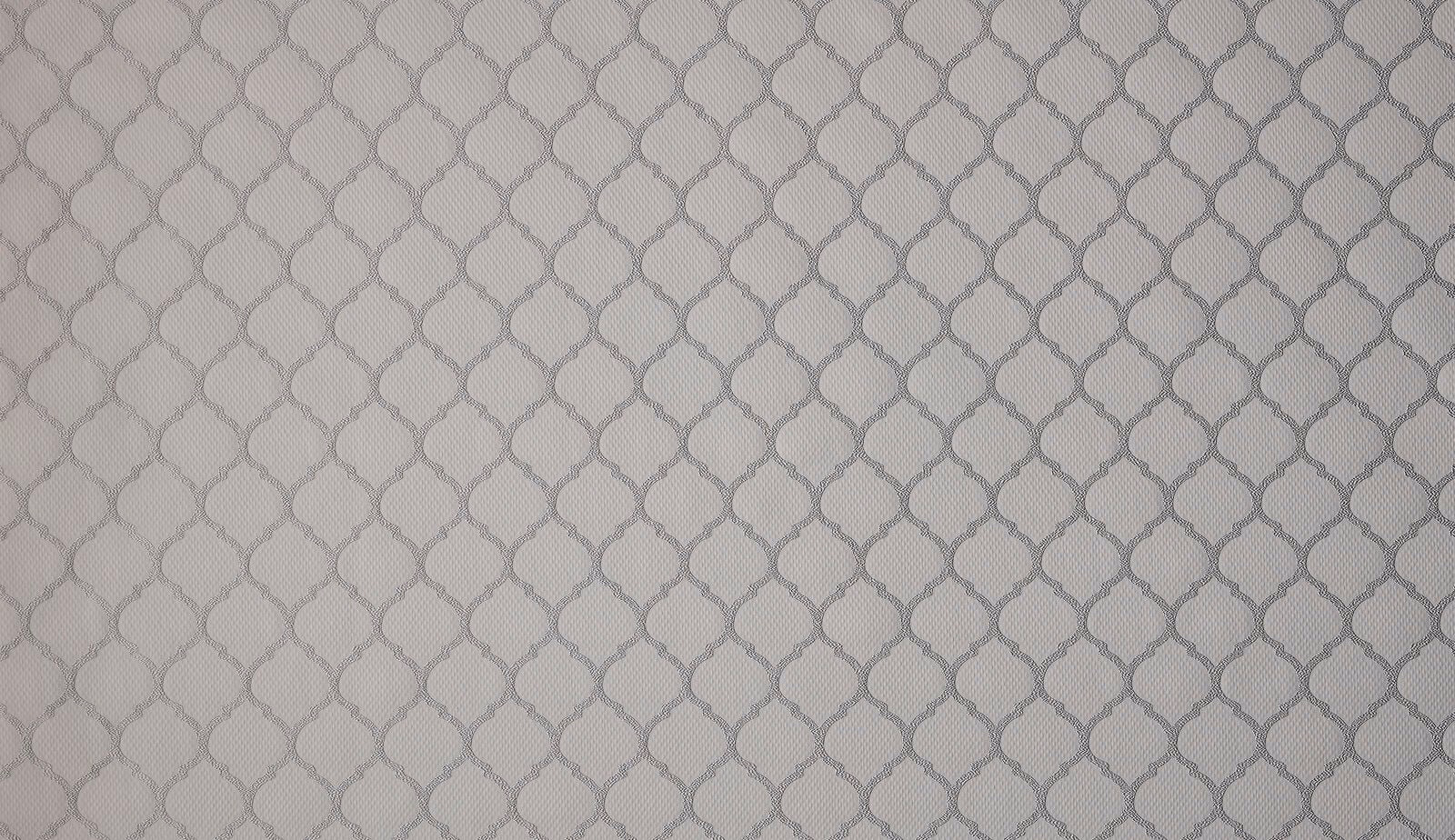 Close-up of warm fawn woven fabric with small geometric pattern