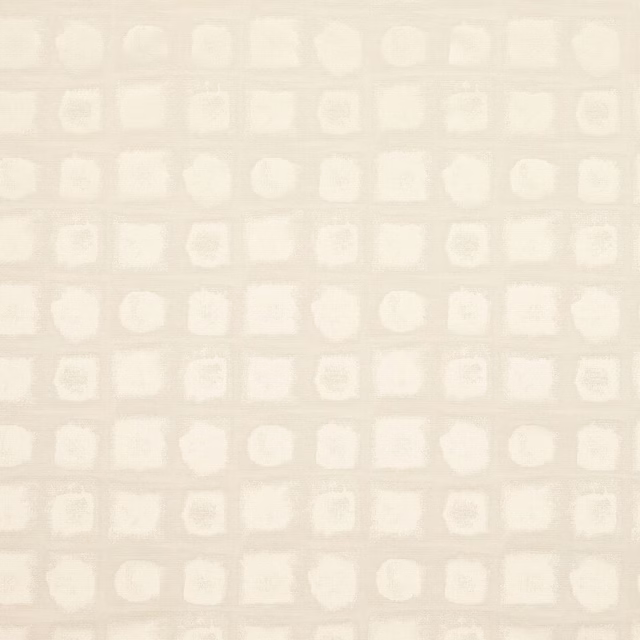 Swatch of ivory geometric woven fabric with small square and circular motifs