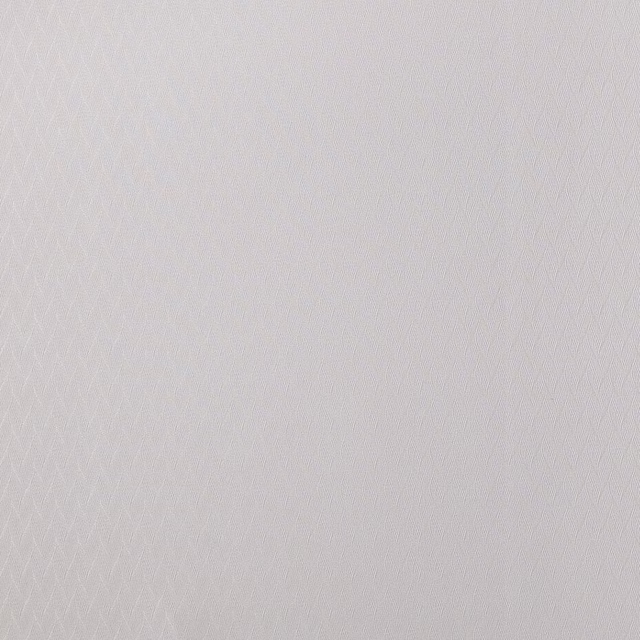 Soft ivory woven fabric with a fine small-scale diamond texture