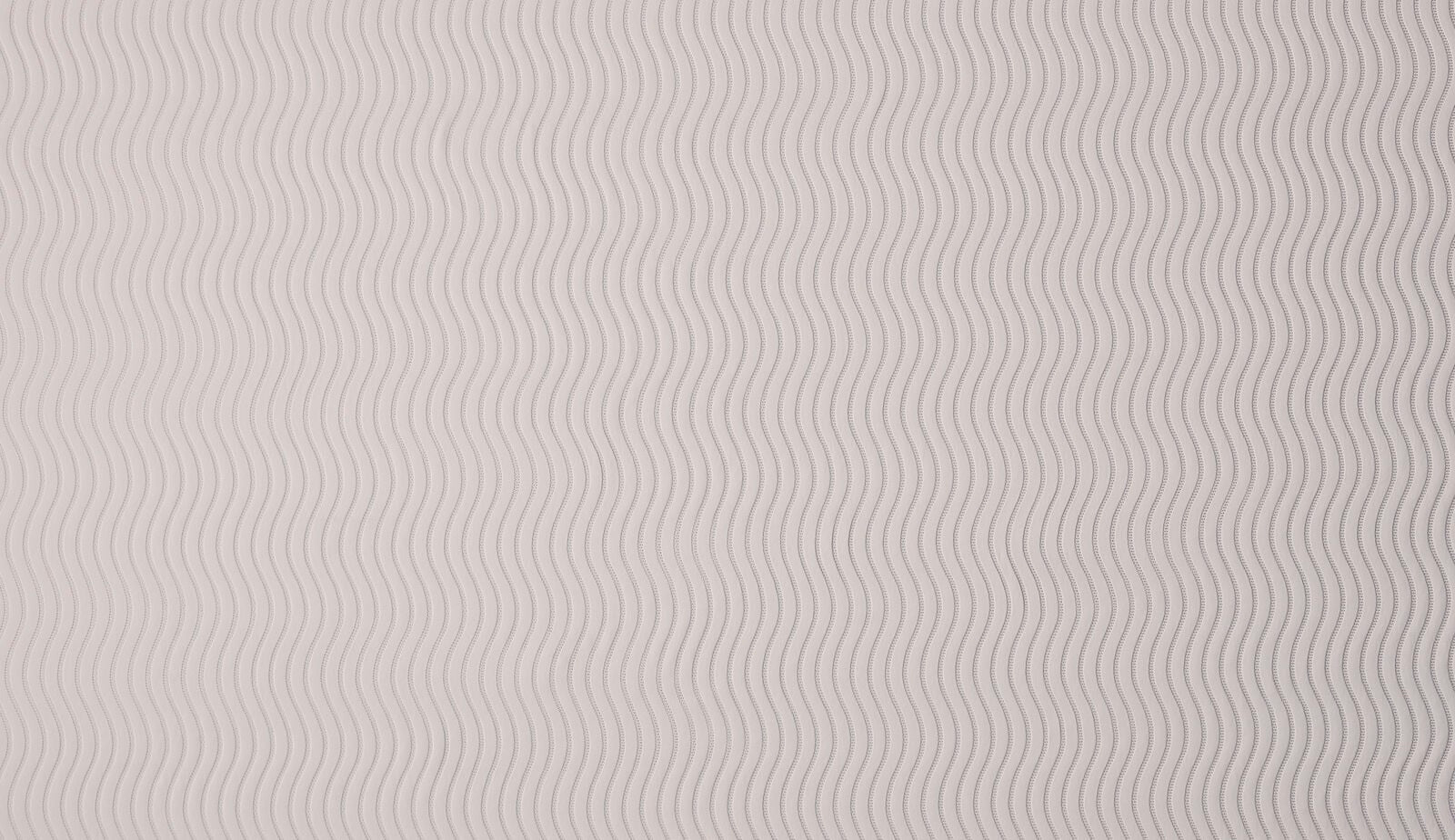 Soft platinum grey fabric with fine wavy vertical stripes and subtle woven texture