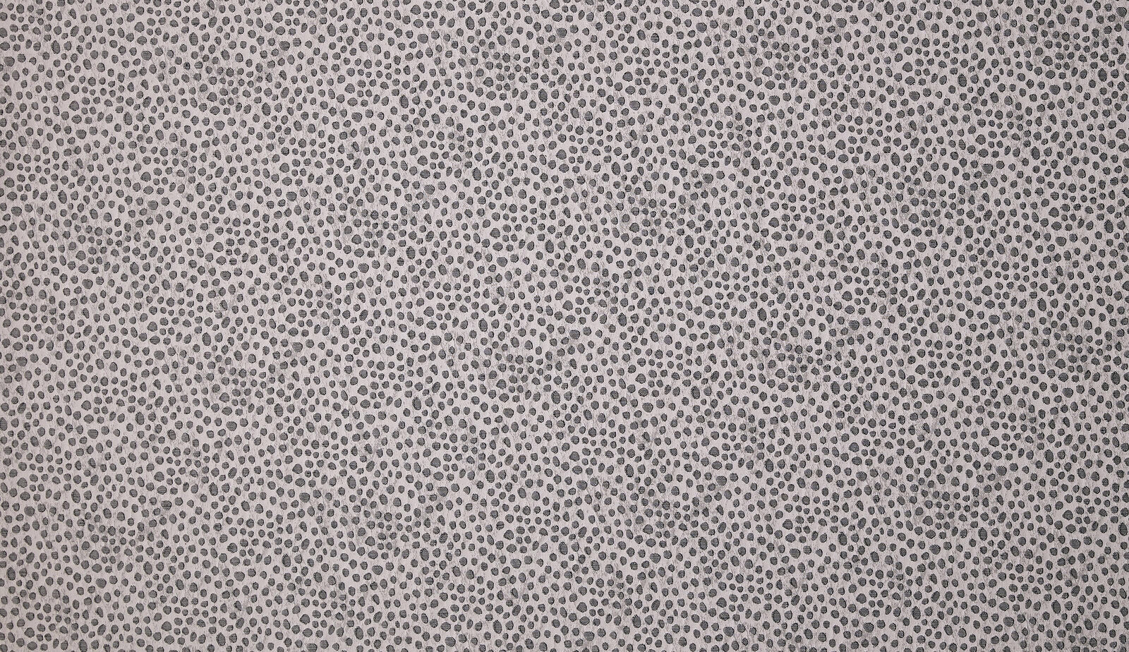Pewter grey textured fabric with tiny dark speckles and a fine woven surface