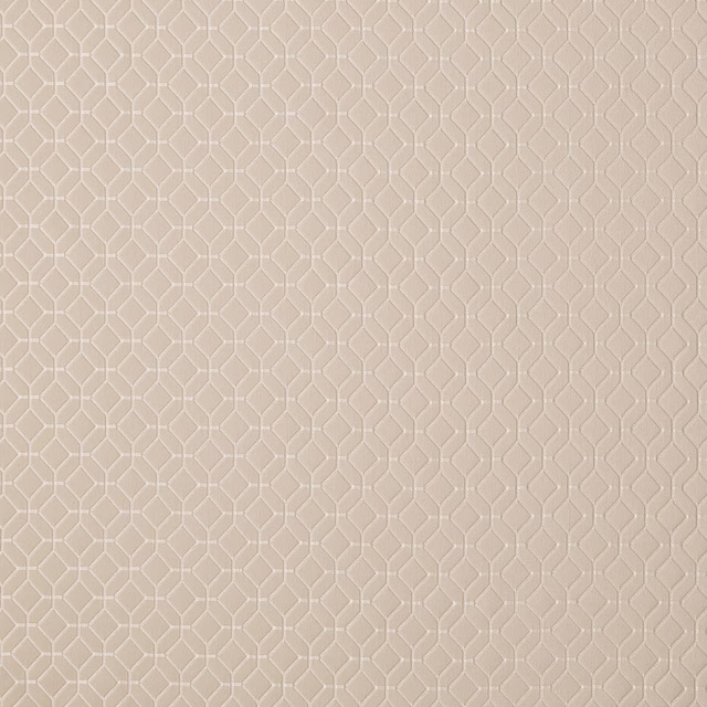 Pale champagne cream woven fabric with a small geometric abstract pattern