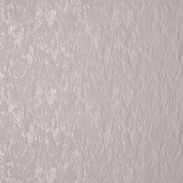 Pale taupe textured floral weave fabric with soft tonal pattern