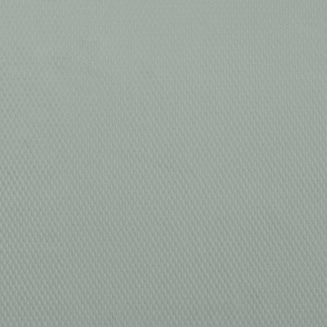 Pale sage green woven fabric with a fine diagonal texture