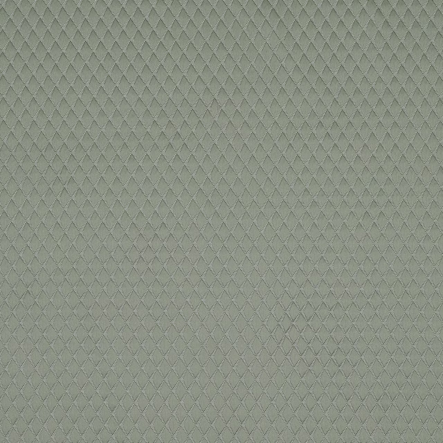 Soft sage green woven fabric with small diamond geometric texture