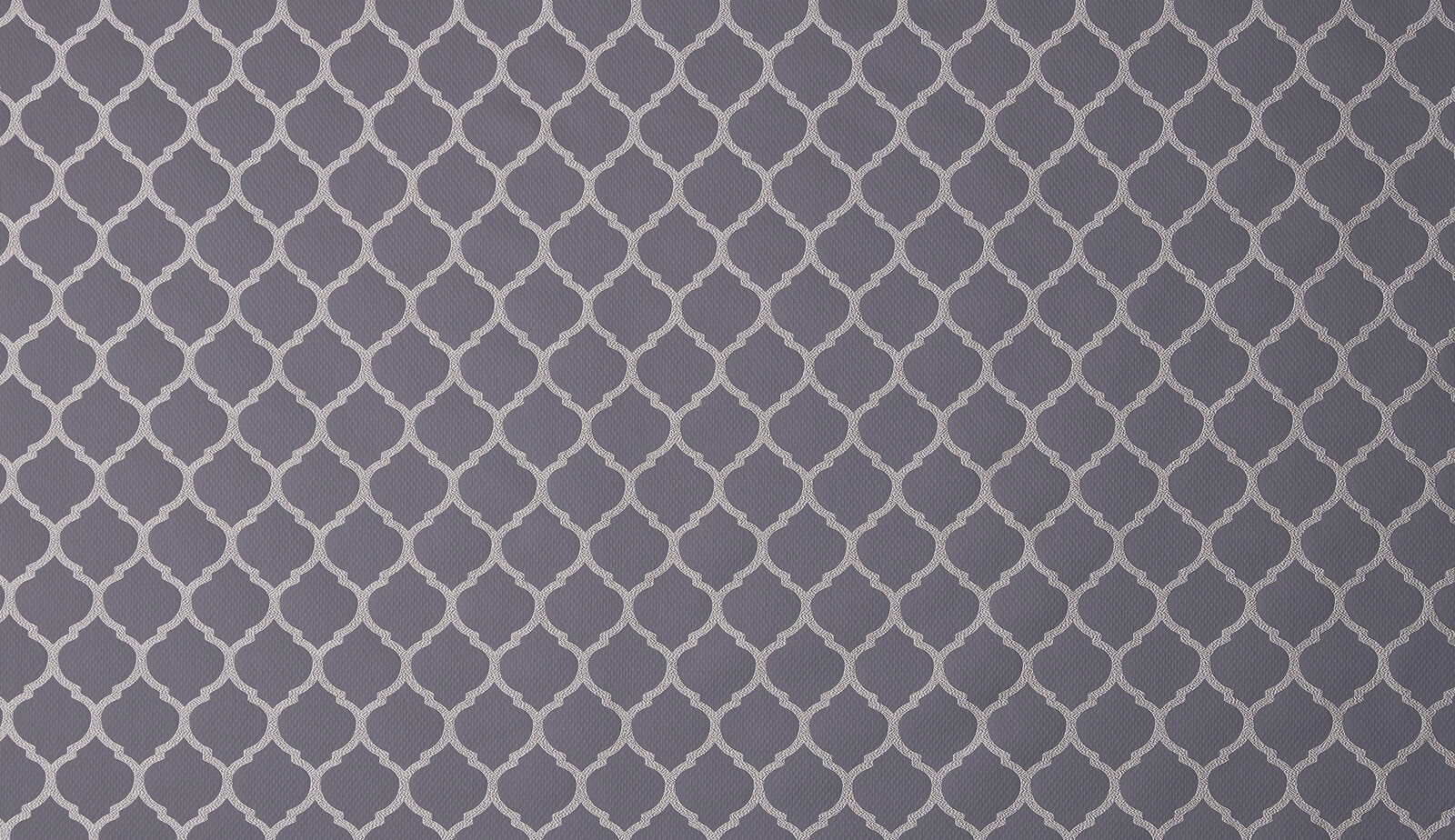 Close-up of grey geometric lattice fabric with pale contrast motif