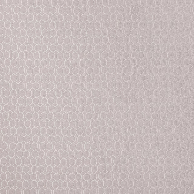Soft orchid pink geometric woven fabric with a small repeating hexagonal motif